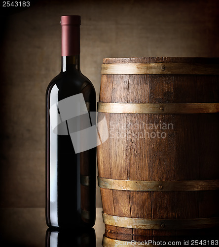 Image of Bottle and wooden barrel