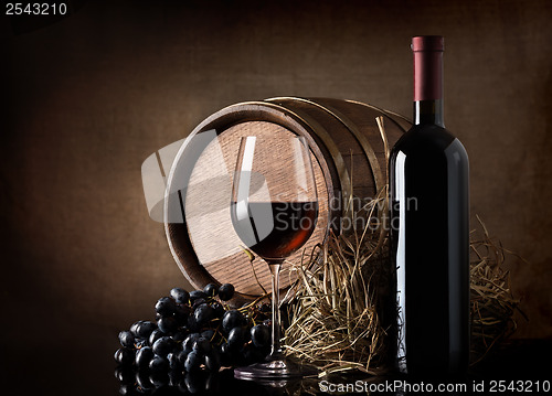Image of Wine with barrel and hay