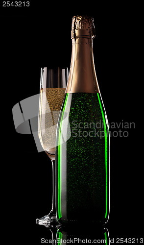 Image of Glass and bottle of champagne