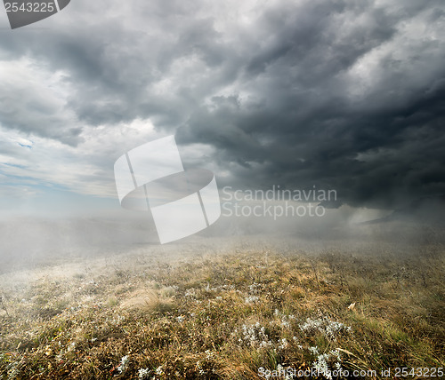 Image of Clouds over the autumn field