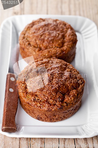 Image of fresh buns and old knife