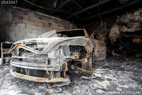 Image of Close up photo of a burned out car