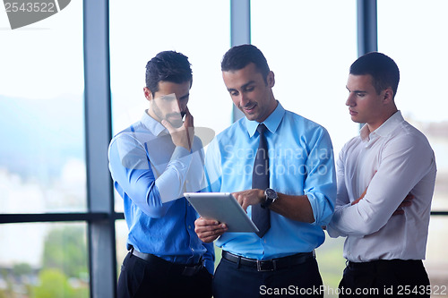 Image of business man using tablet compuer at office