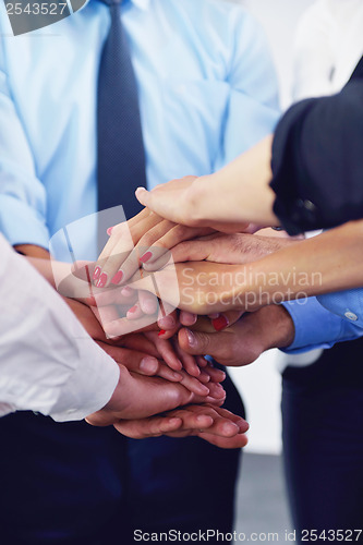 Image of business people group joining hands