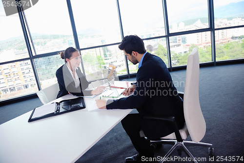 Image of business people group in a meeting at office