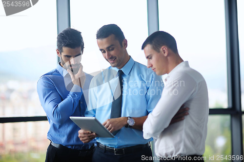 Image of business man using tablet compuer at office