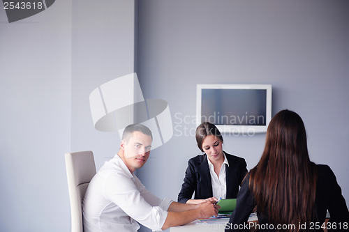 Image of business people group in a meeting at office