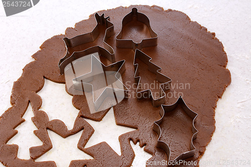 Image of Cookie cutters and shapes in gingerbread dough