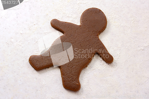 Image of Gingerbread man shape in cookie dough