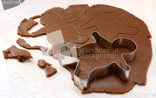 Image of Gingerbread man shapes in cookie dough