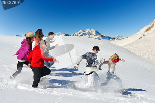 Image of friends have fun at winter on fresh snow