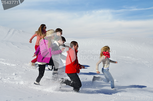 Image of friends have fun at winter on fresh snow