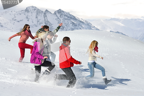 Image of friends have fun at winter on fresh snow