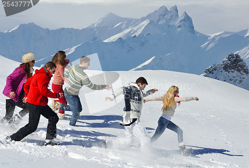 Image of friends have fun at winter on fresh snow