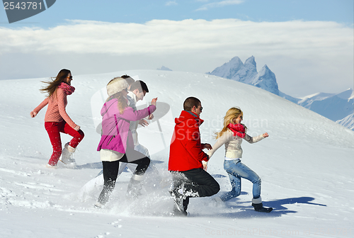 Image of friends have fun at winter on fresh snow