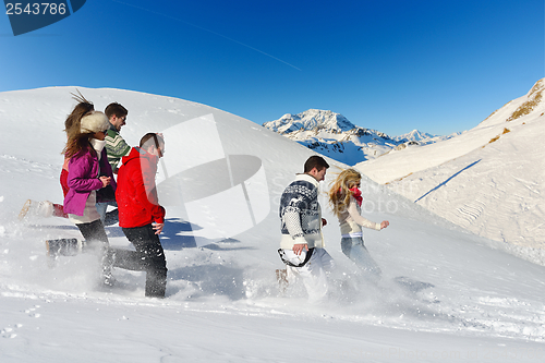 Image of friends have fun at winter on fresh snow