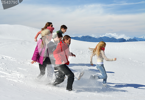 Image of friends have fun at winter on fresh snow