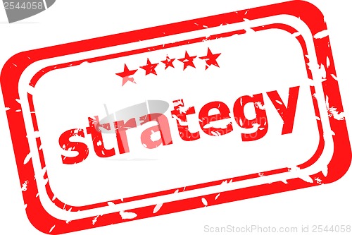 Image of strategy on red rubber stamp over a white background