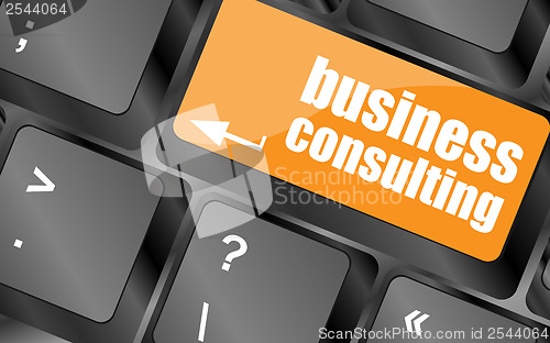 Image of Computer keyboard with business consulting key. business concept