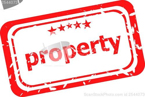 Image of property on red rubber stamp over a white background