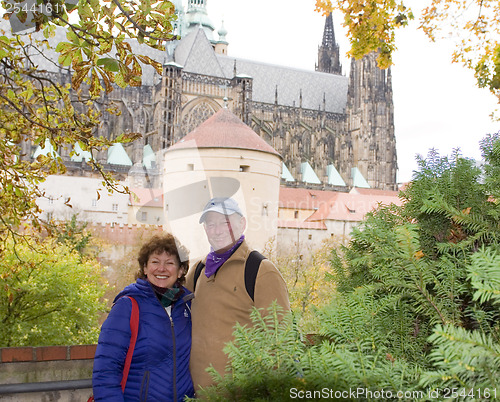 Image of middle age senior smiling man woman tourist couple Castle Distri