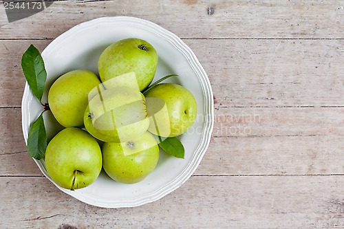 Image of fresh green apples in plate