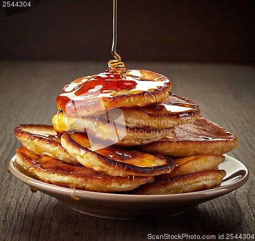 Image of pancakes with maple syrup on plate