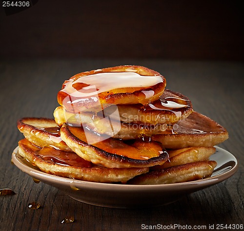Image of pancakes with maple syrup on plate