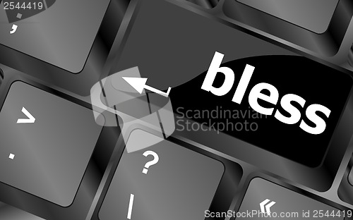 Image of bless text on computer keyboard key - business concept