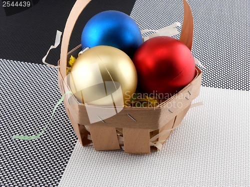 Image of Christmas balls set in basket