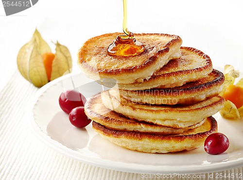 Image of stack of pancakes on white plate