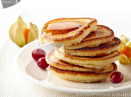 Image of stack of pancakes on white plate