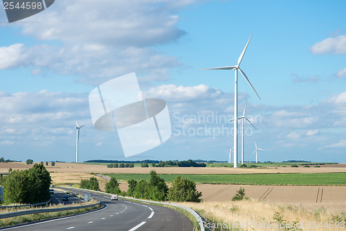 Image of Wind generator turbine on summer landscape