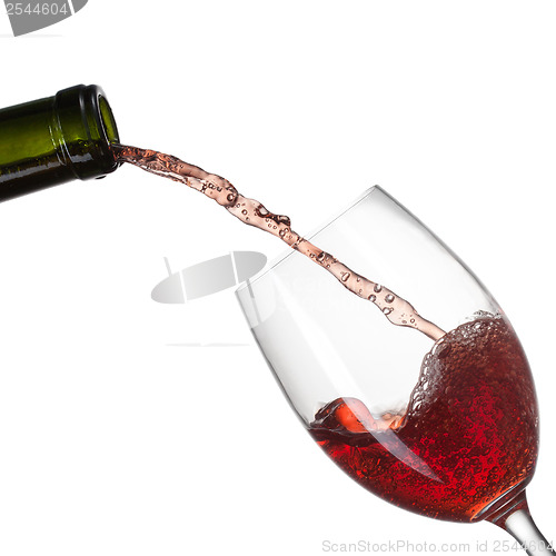 Image of Red wine pouring into glass with splash isolated on white