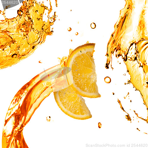 Image of orange slices and splashes of juice isolated on white