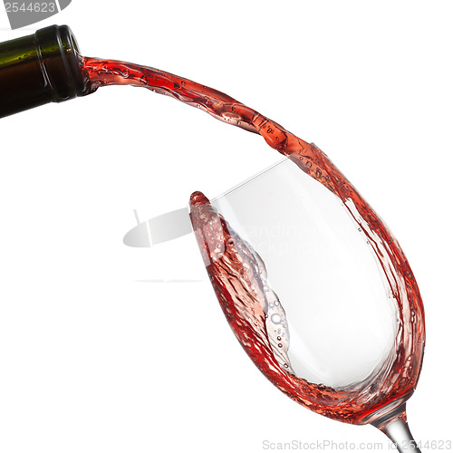 Image of Red wine pouring into glass with splash isolated on white