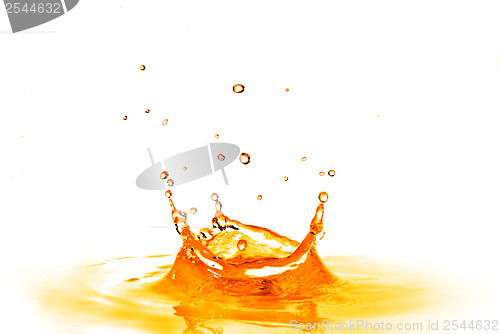 Image of drop falling into orange water with splash isolated on white