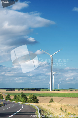 Image of Wind generator turbine on summer landscape