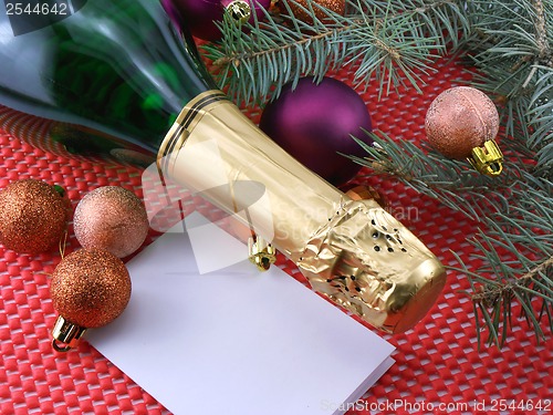 Image of champagne bottle and christmas decoration, happy new year and merry christmas