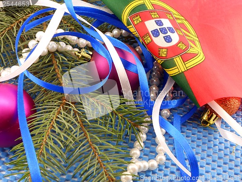 Image of portugal flag with christmas decoration, new year card