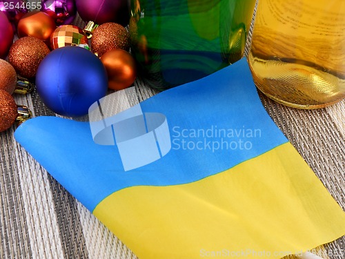 Image of Ukraine flag with christmas decoration, new year card