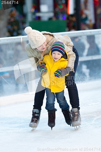 Image of family ice skating