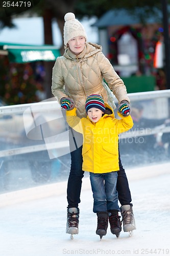 Image of family ice skating