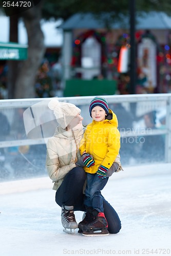 Image of family ice skating