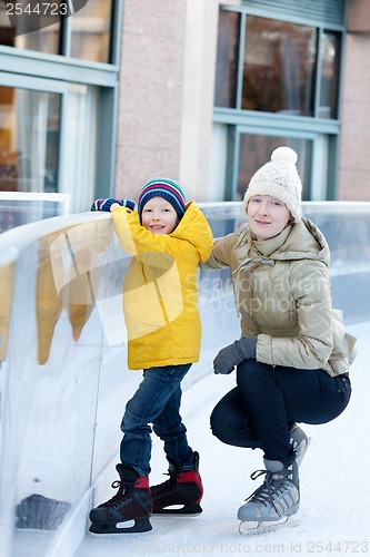 Image of family ice skating