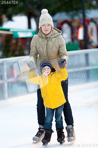 Image of family ice skating