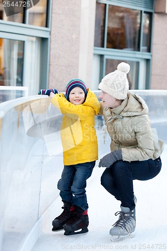 Image of family ice skating