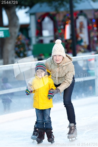 Image of family ice skating