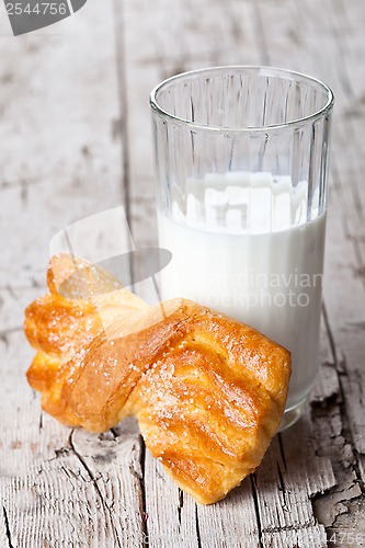 Image of glass of milk and fresh baked bun 