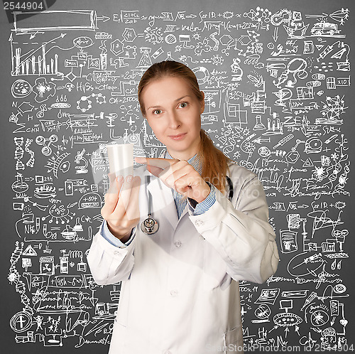 Image of Doctor woman with cup for analysis